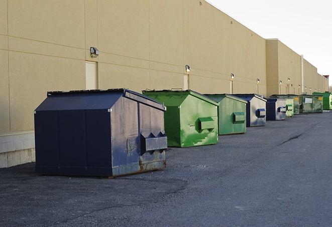 metal waste containers sit at a busy construction site in Berea, OH